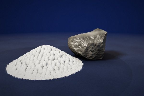 Perlite: a grey raw perlite rock and white expanded perlite granules